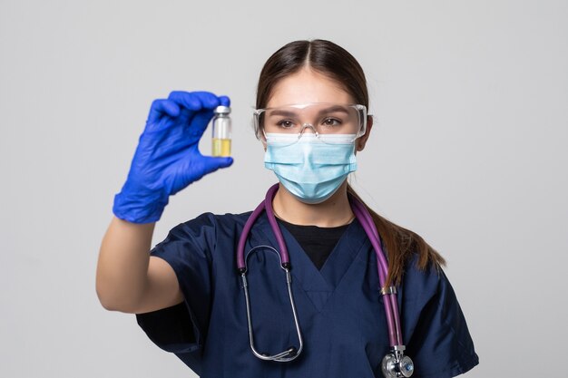 Medical doctor or laborant holding tube with nCoV Coronavirus vaccine for 2019-nCoV virus