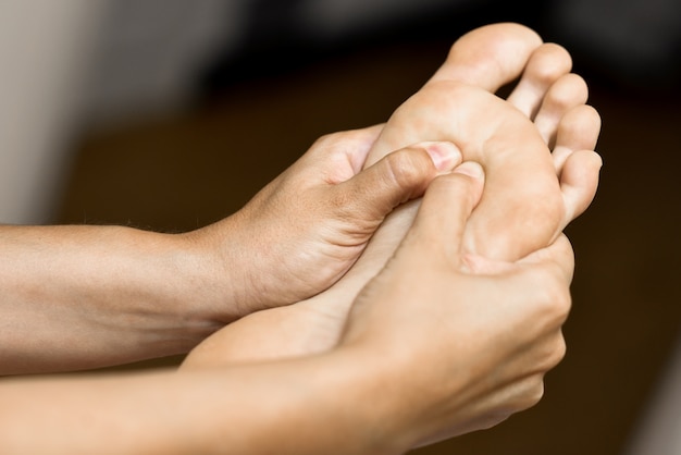 Medical massage at the foot in a physiotherapy center.