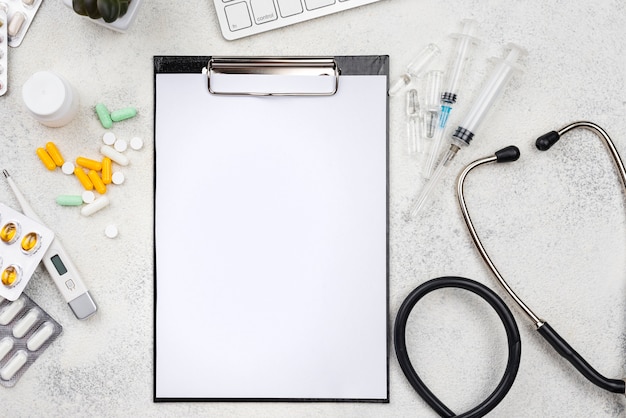 Medical objects assortment with empty clipboard