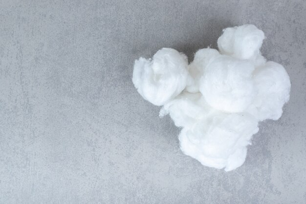 Medical soft cotton wool on a gray surface