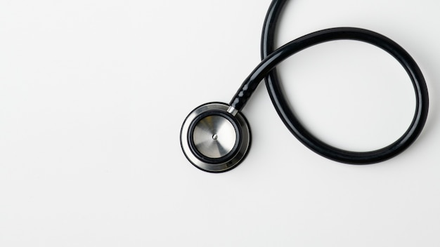 Medical stethoscope on a white surface