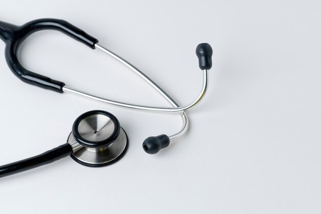 Medical stethoscope on a white surface