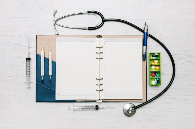 Medical supplies around notepad