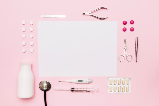 Medical supplies around paper sheet