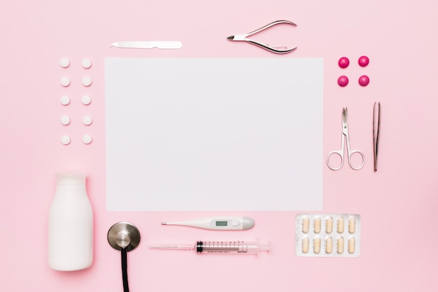 Medical supplies around paper sheet