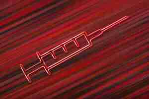 Foto gratuita simbolo della siringa medica, vaccinazione, concetto stop coronavirus, sfondo rosso