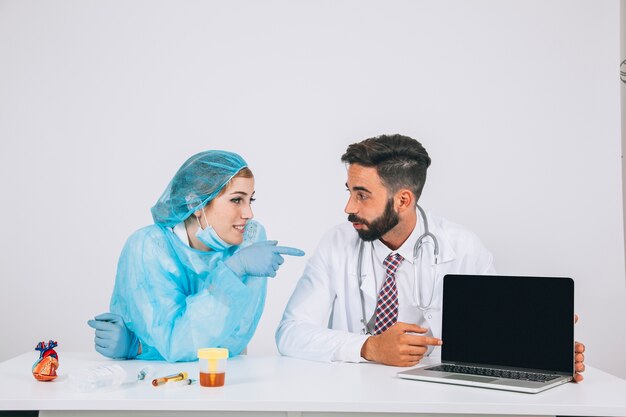 Medical team and laptop's screen