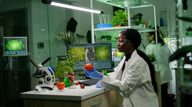 medical team researcher working in pharmacology laboratory examining organic food