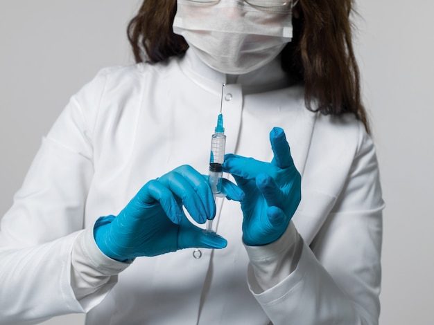 Medical worker preparing an injection