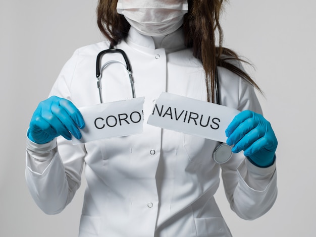 Medical worker rips coronavirus written paper