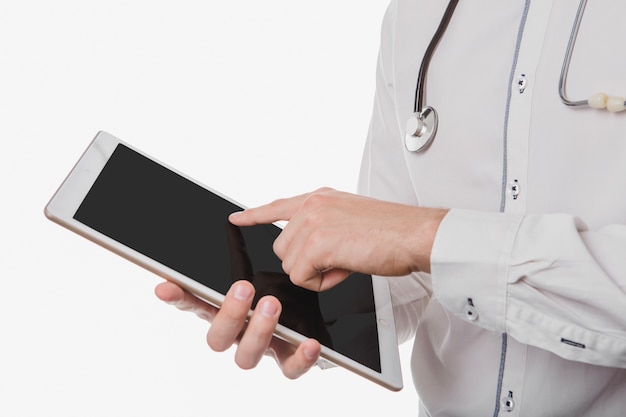 Free photo medical worker tapping on tablet