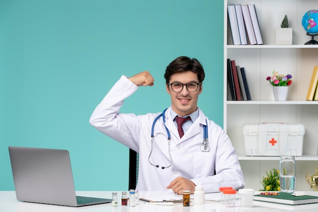 Medical working on computer remotely serious cute smart doctor in lab coat showing power