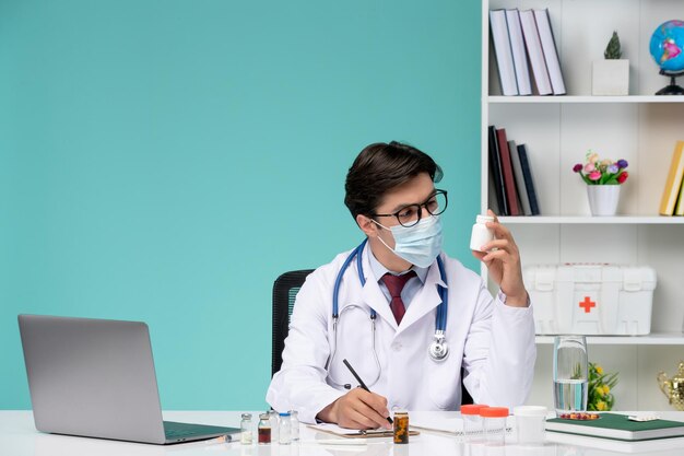 Medical working on computer remotely serious cute smart doctor in lab coat