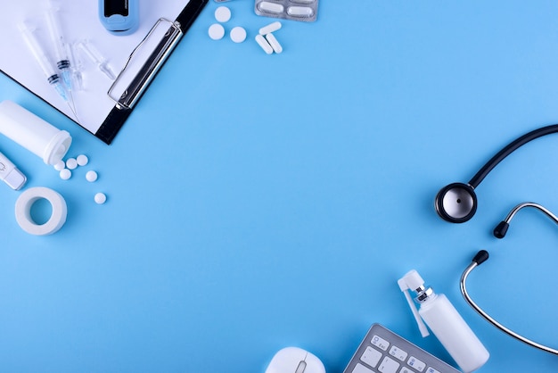 Medicine on blue background flat lay