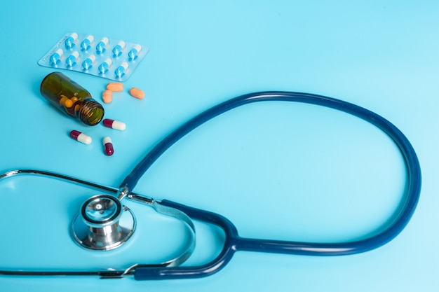 Free photo of medicines, medical supplies placed on a blue  .