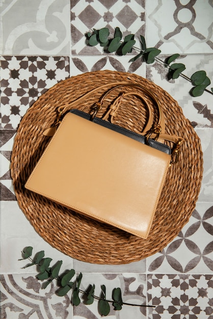 Free photo mediterranean aesthetic tiles with women's bag