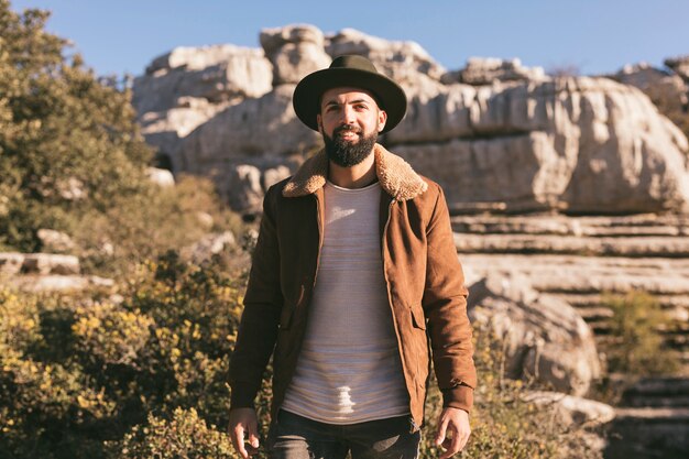 Medium shoot man posing in nature