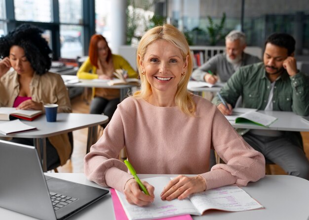 Medium shot adults studying together