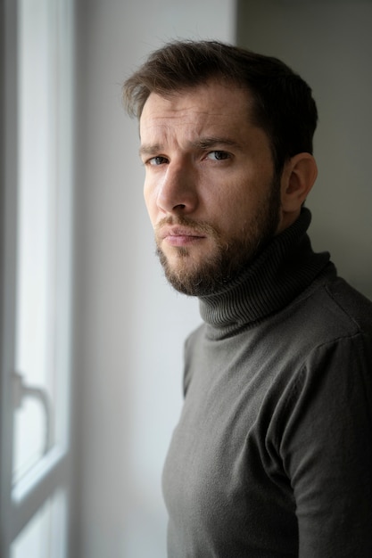 Free photo medium shot anxious man indoors