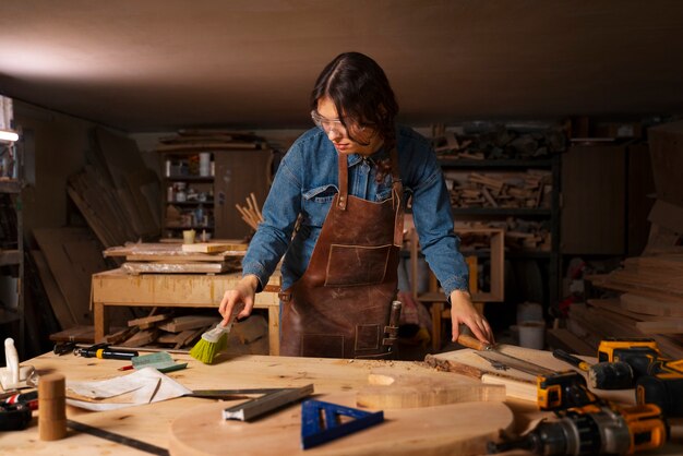 Medium shot artisan doing woodcutting