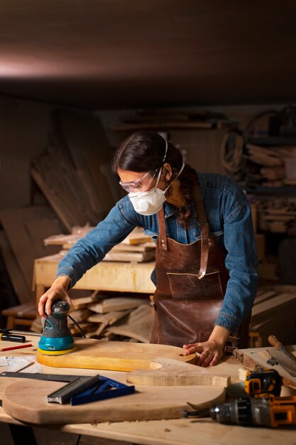 Medium shot artisan doing woodcutting