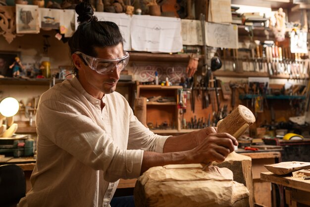 Free photo medium shot artisan doing woodcutting