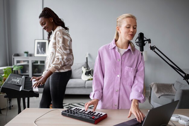 Medium shot artists making music indoors