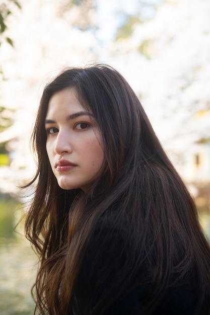 Medium shot asian woman in nature