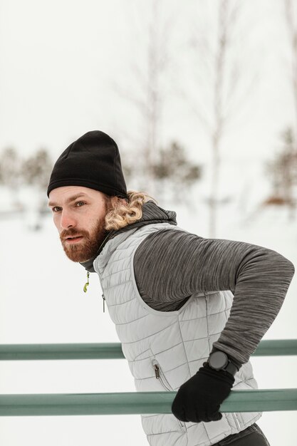 medium shot athlete holding bars