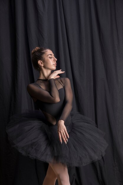 Medium shot ballerina with hand under chin