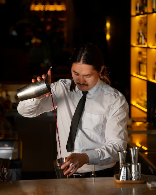 Medium shot bartender preparing drink