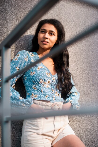 Medium shot of beautiful woman looking away