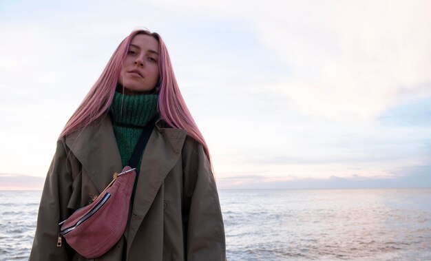 Medium shot beautiful woman at seaside