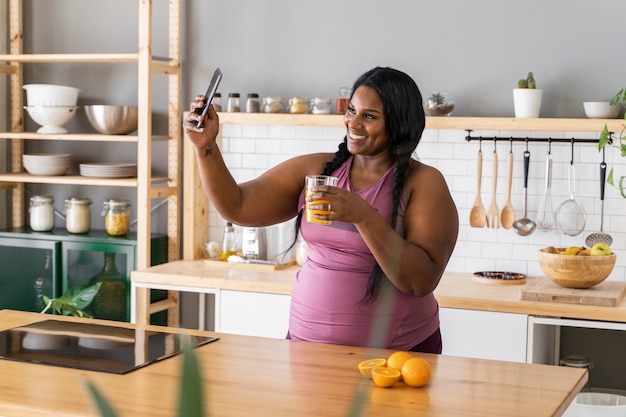 Medium shot black woman relaxing at home