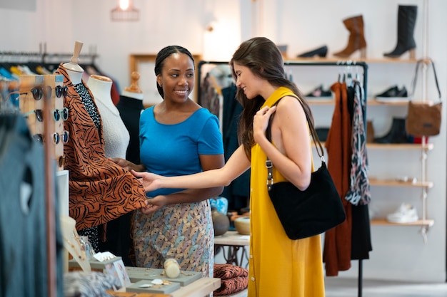 Medium shot black woman running a small business