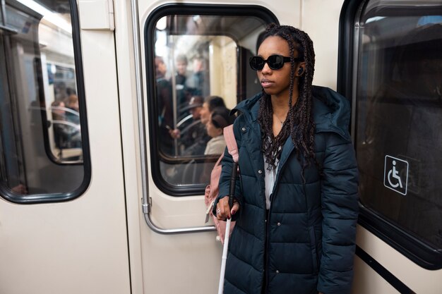 Medium shot blind woman traveling alone