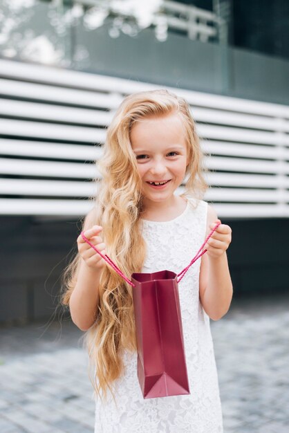 Medium shot blonde girl smiling