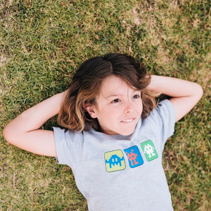 Free Photo medium shot of boy lying on grass