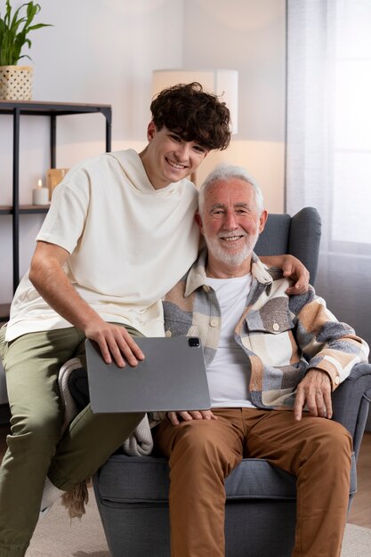 Medium shot boy and man sitting together