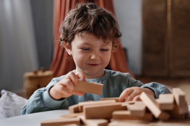 Medium shot boy playing memory game