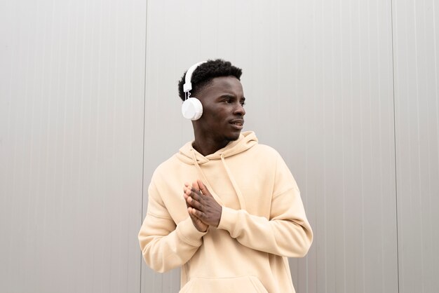 Medium shot boy posing with headphones