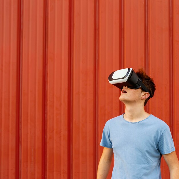 Medium shot boy wearing vr glasses