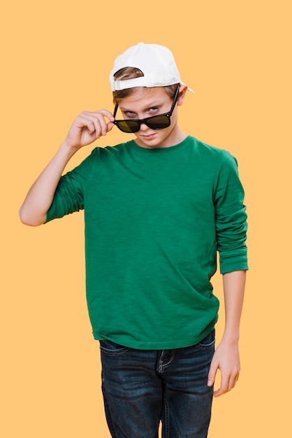 Medium shot of boy with sunglasses