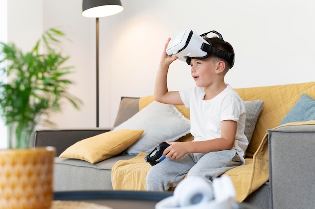 Medium shot boy with vr glasses