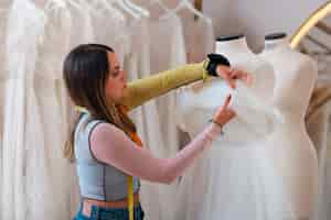 Free photo medium shot brazilian woman working as clothing designer