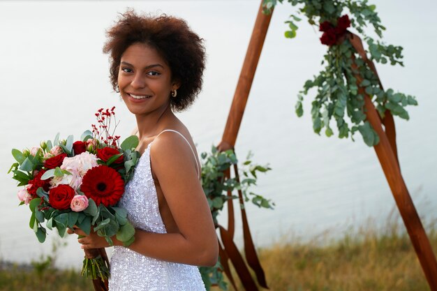 Medium shot bride posing outdoors