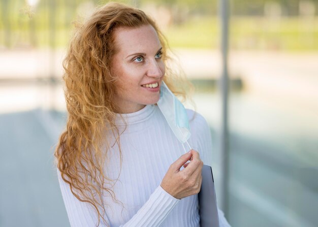 Medium shot of businesswoman looking up