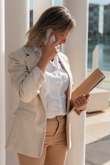 Medium shot busy woman on phone