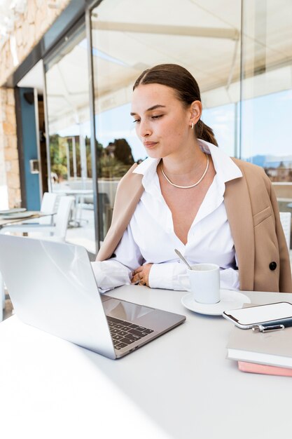 Medium shot busy woman working outdoors