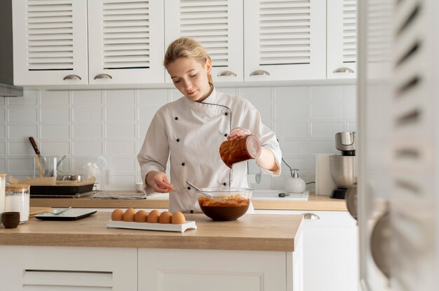 Medium shot chef cooking in kitchen